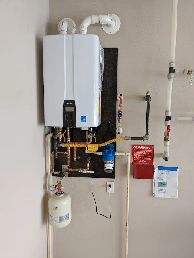 Professional plumber installing copper piping in a Evansville home